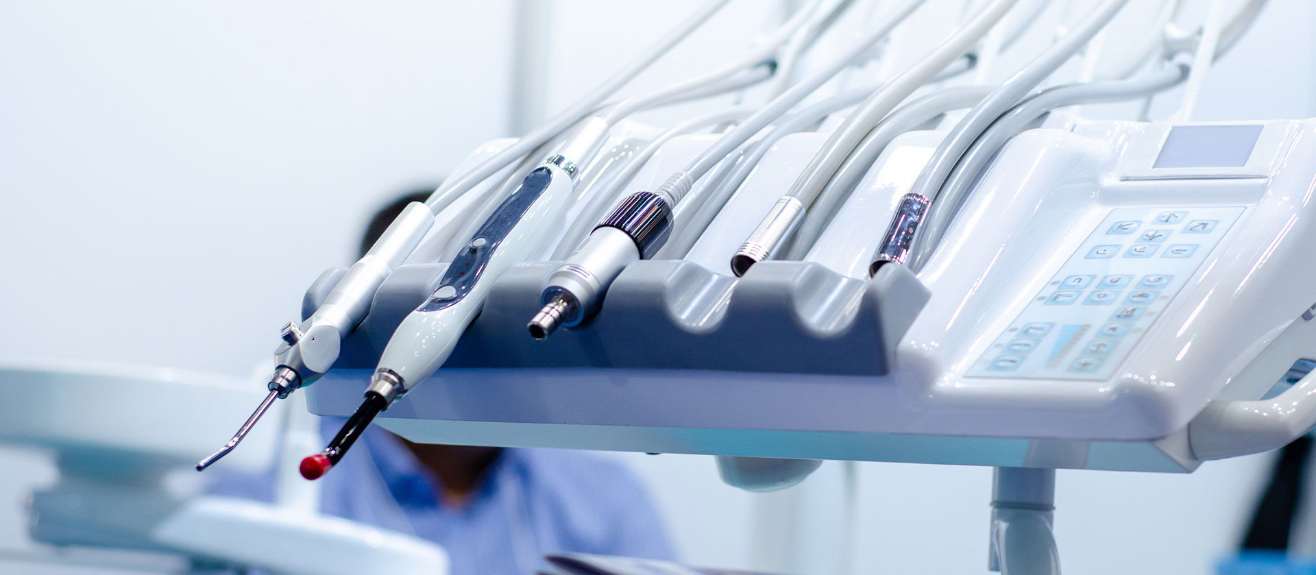 The image shows a person working with medical equipment, likely in a laboratory or clinical setting.